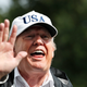 President Donald Trump, noted white supremacist, waves after answering a question from the media as he arrives at the White House yesterday. (AP Photo/Alex Brandon)